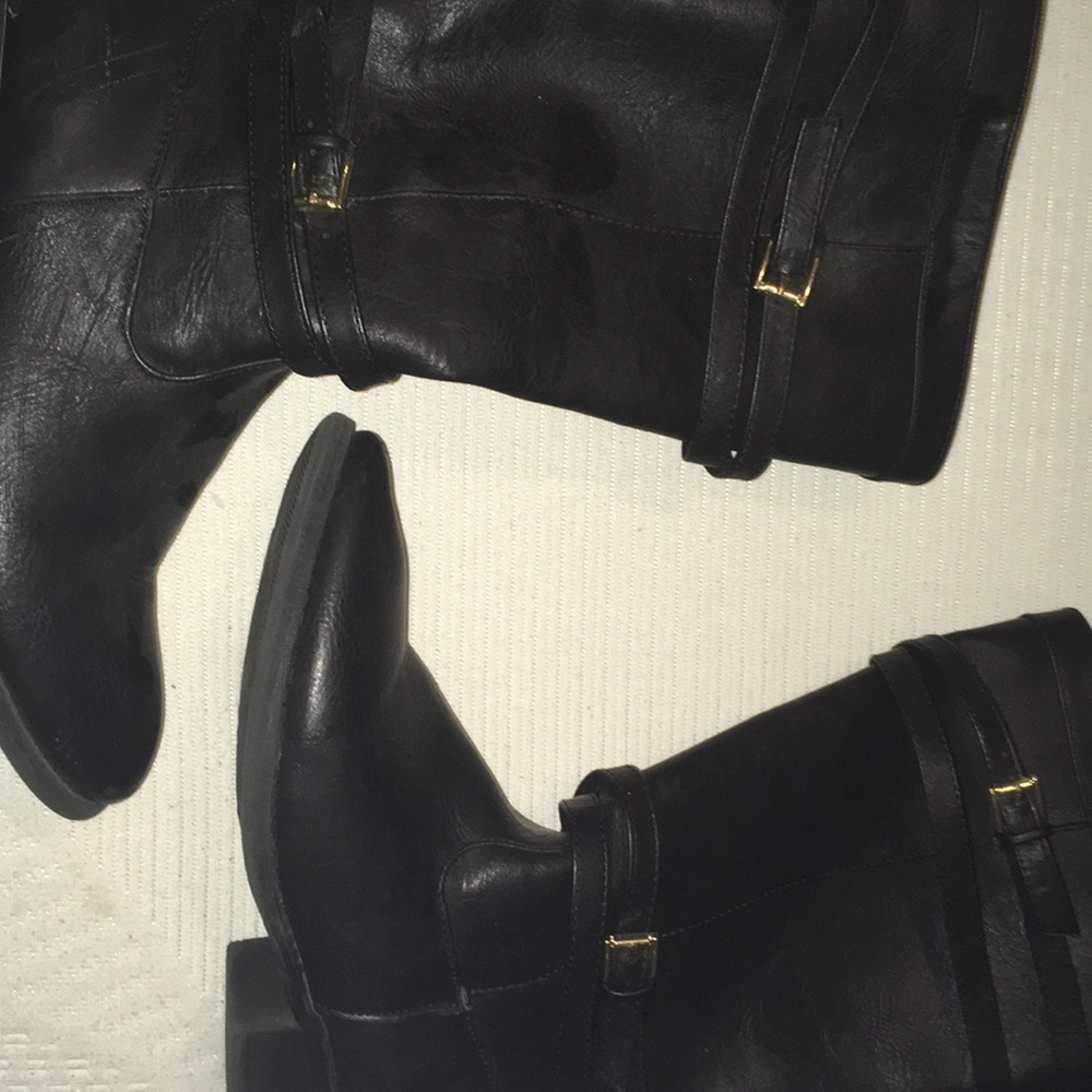 cute black boots with belts on them